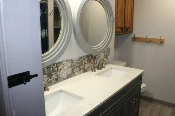 a bathroom with a sink and a mirror
