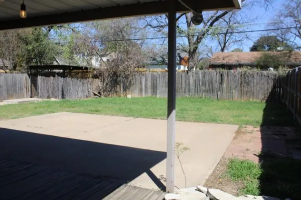 a view of a backyard of the house