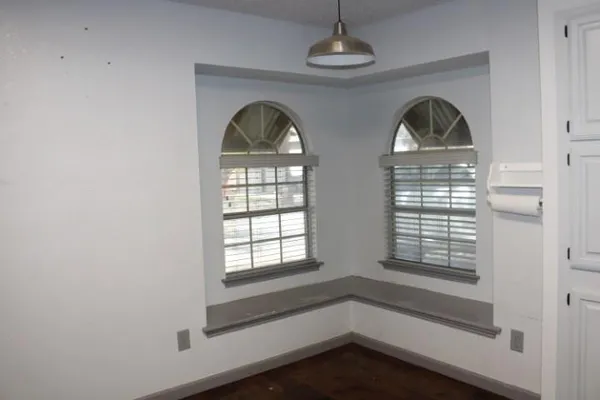 a view of empty room with windows