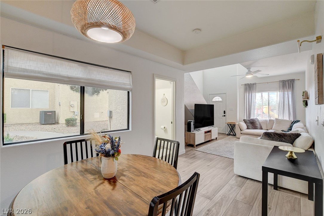 64 Brown Swallow Way Henderson, NV 89012 - Photo 12 of 42 Dining area with light wood finished floors and a ceiling fan