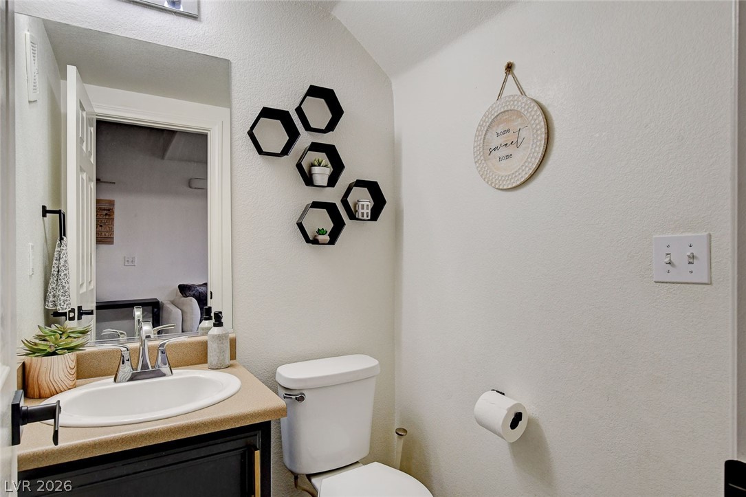 64 Brown Swallow Way Henderson, NV 89012 - Photo 21 of 42 Bathroom featuring vanity and a textured wall