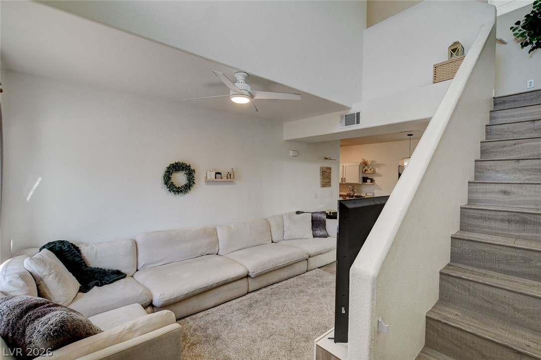 64 Brown Swallow Way Henderson, NV 89012 - Photo 22 of 42 Living area with stairs and ceiling fan