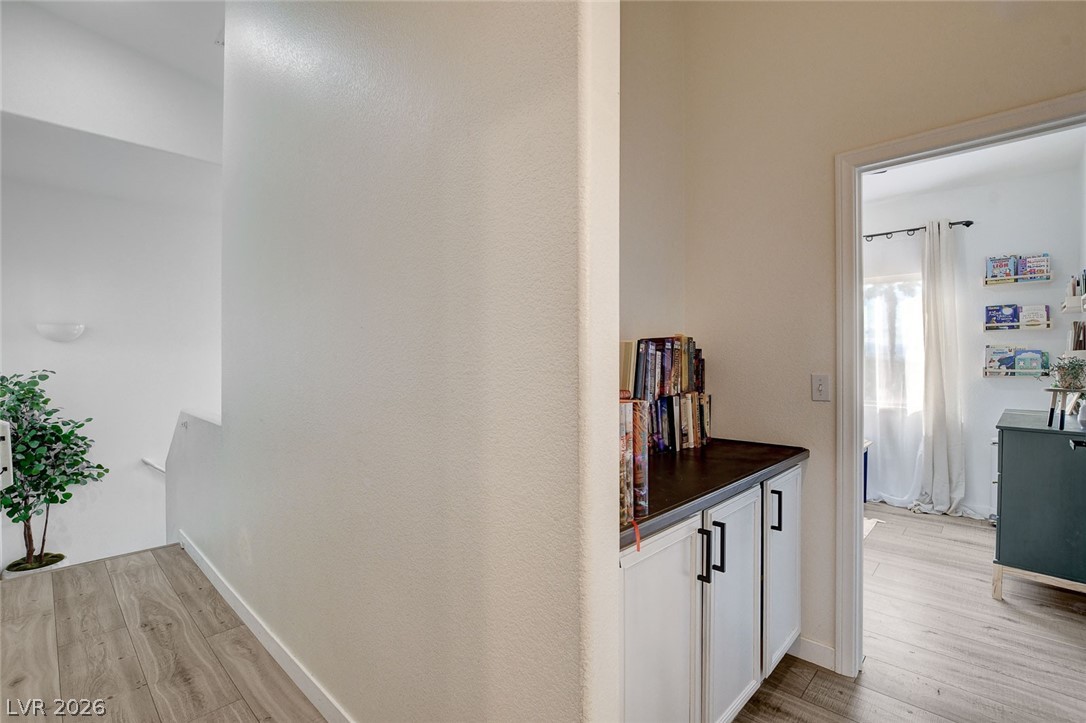 64 Brown Swallow Way Henderson, NV 89012 - Photo 23 of 42 Hall featuring light wood-style floors