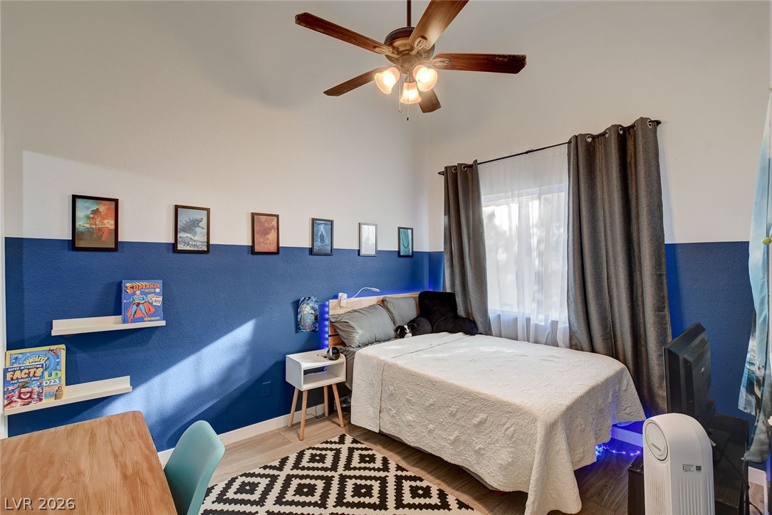 64 Brown Swallow Way Henderson, NV 89012 - Photo 33 of 42 Bedroom with wood finished floors and a ceiling fan