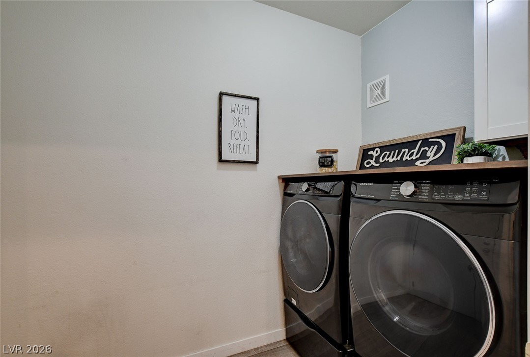 64 Brown Swallow Way Henderson, NV 89012 - Photo 36 of 42 Laundry area featuring baseboards and washer and dryer