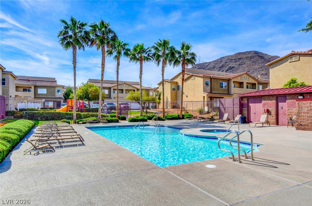 64 Brown Swallow Way Henderson, NV 89012 - Photo 40 of 42 Community pool featuring a residential view, a patio, and a mountain view