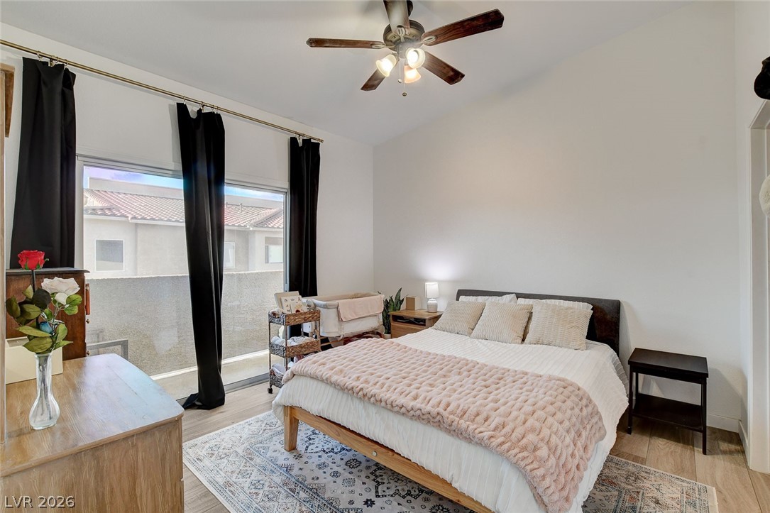 64 Brown Swallow Way Henderson, NV 89012 - Photo 5 of 42 Bedroom featuring light wood finished floors, vaulted ceiling, and ceiling fan