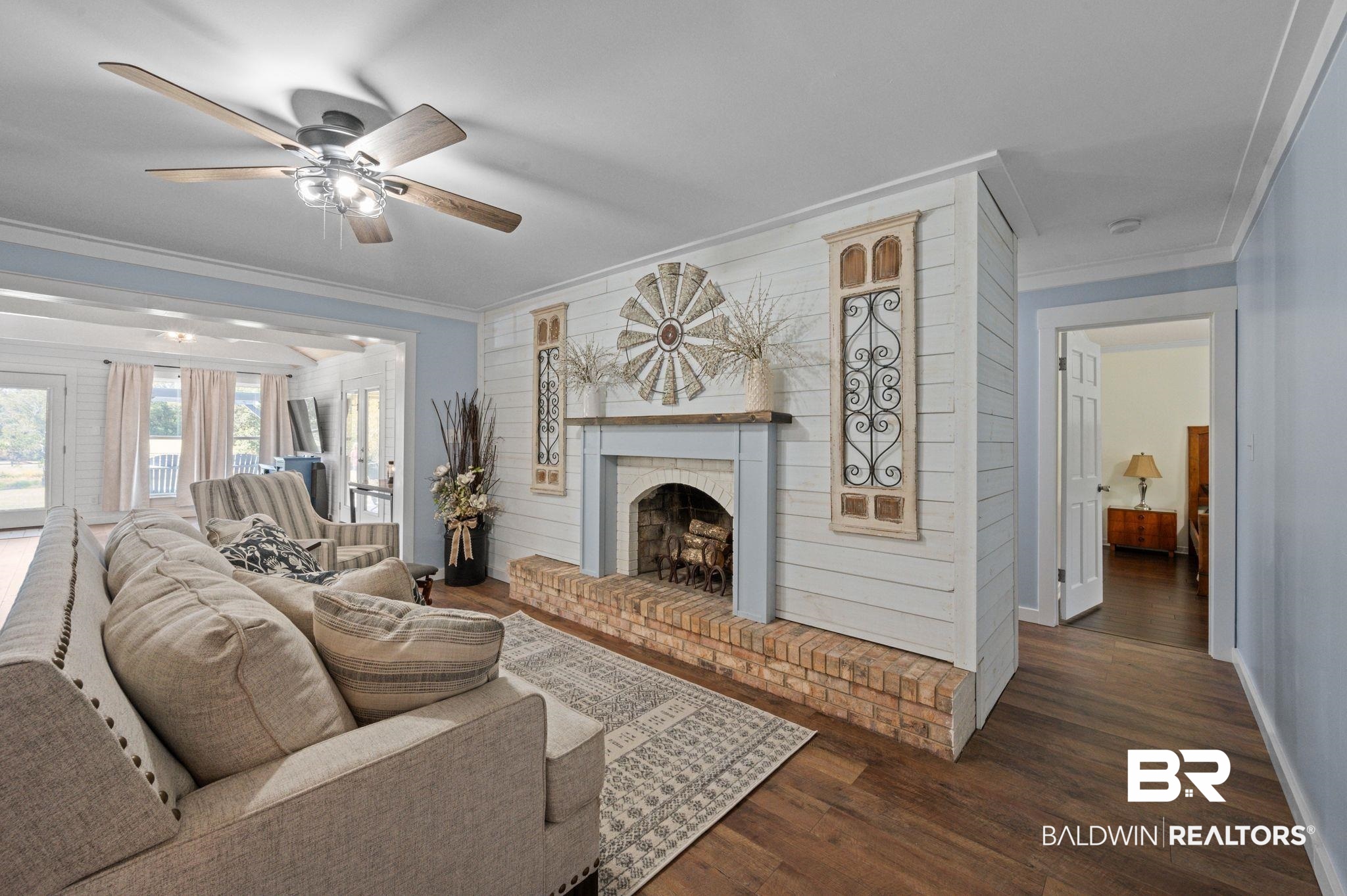 20037 County Road 33 Fairhope, AL 36532 - Photo 6 of 79 Living room with ornamental molding, dark wood-type flooring, a fireplace, and ceiling fan
