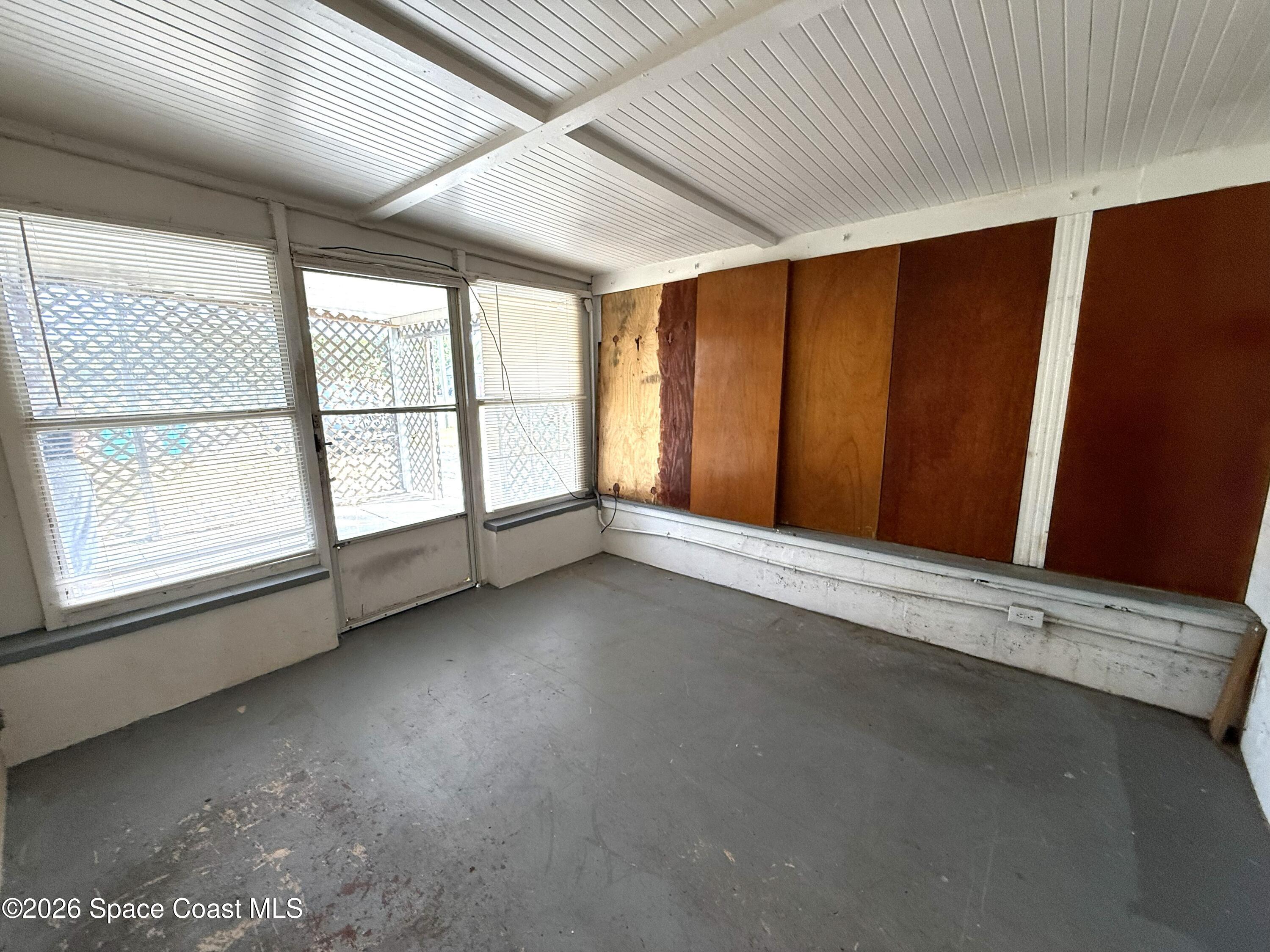 2127 Smathers Circle South, Unit B Melbourne, FL 32935 - Photo 16 of 32 an empty room with windows