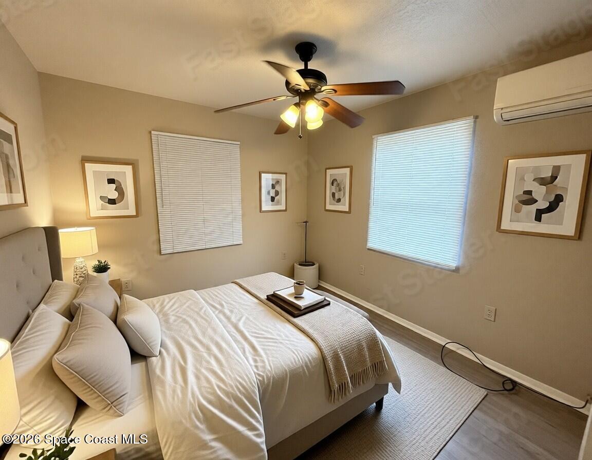 2127 Smathers Circle South, Unit B Melbourne, FL 32935 - Photo 7 of 32 a bedroom with a bed and window