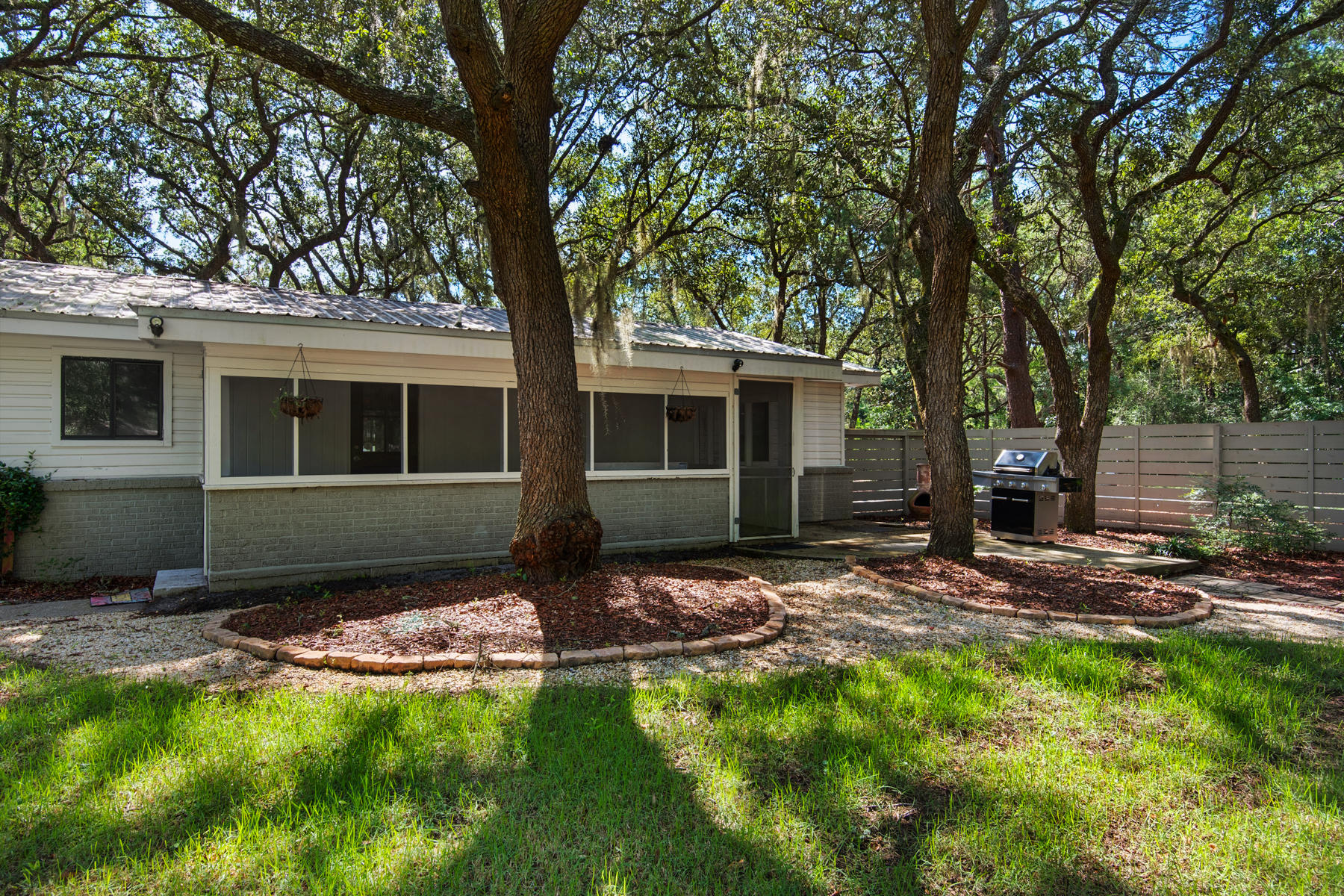 537 Ricker Avenue Santa Rosa Beach, FL 32459 - Photo 14 of 18 a front view of a house with garden