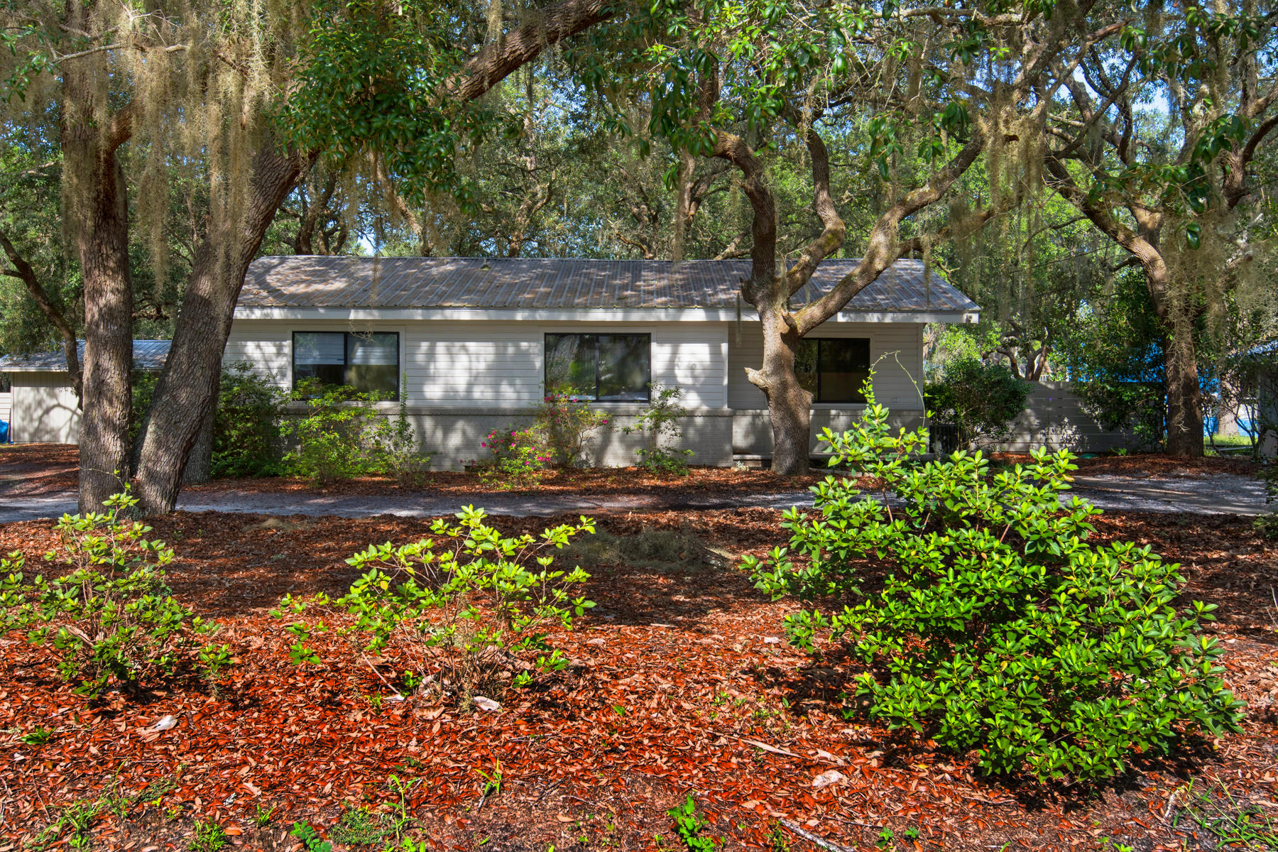 537 Ricker Avenue Santa Rosa Beach, FL 32459 - Photo 17 of 18 front view of a house with a garden