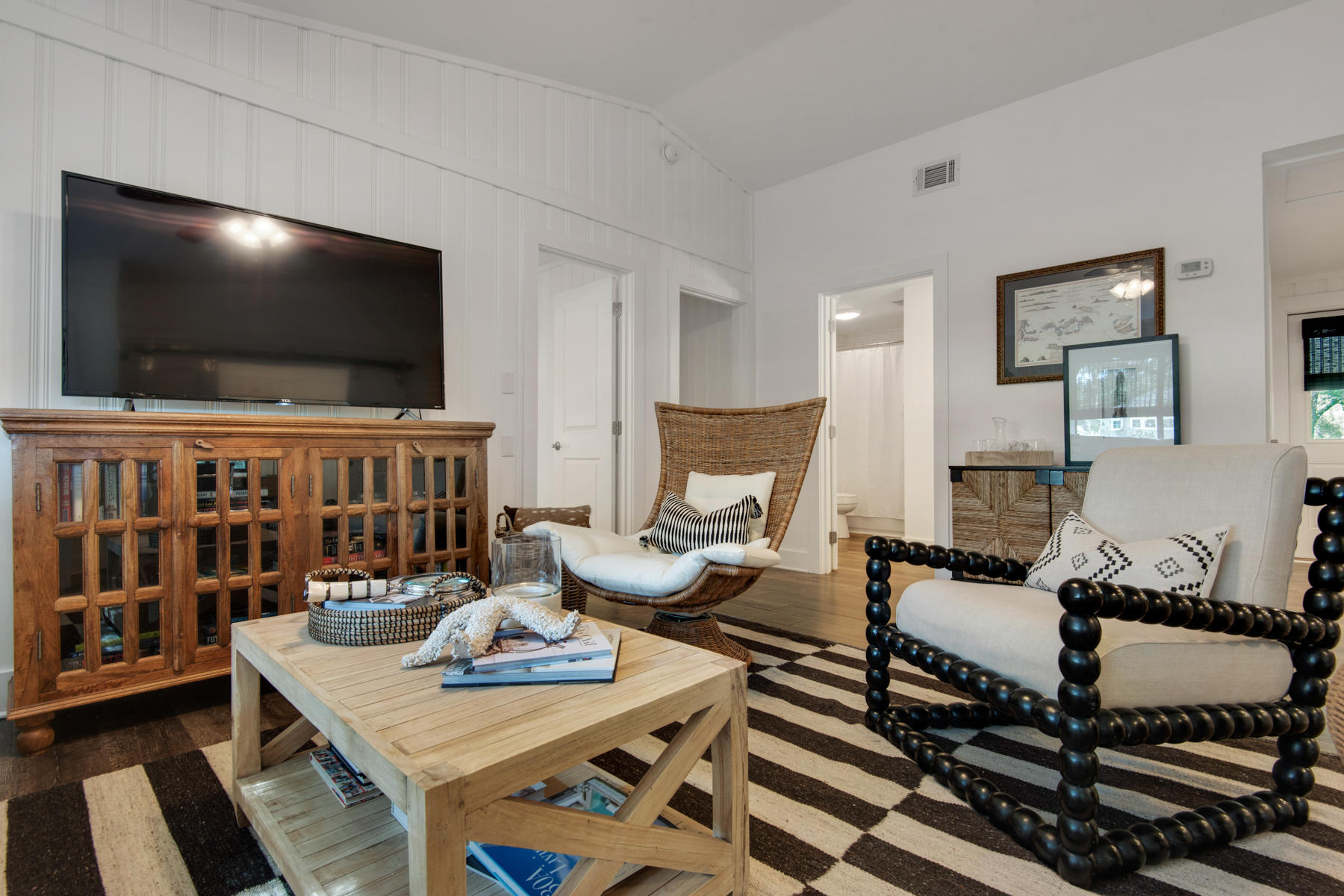 537 Ricker Avenue Santa Rosa Beach, FL 32459 - Photo 2 of 18 a living room with furniture and a flat screen tv