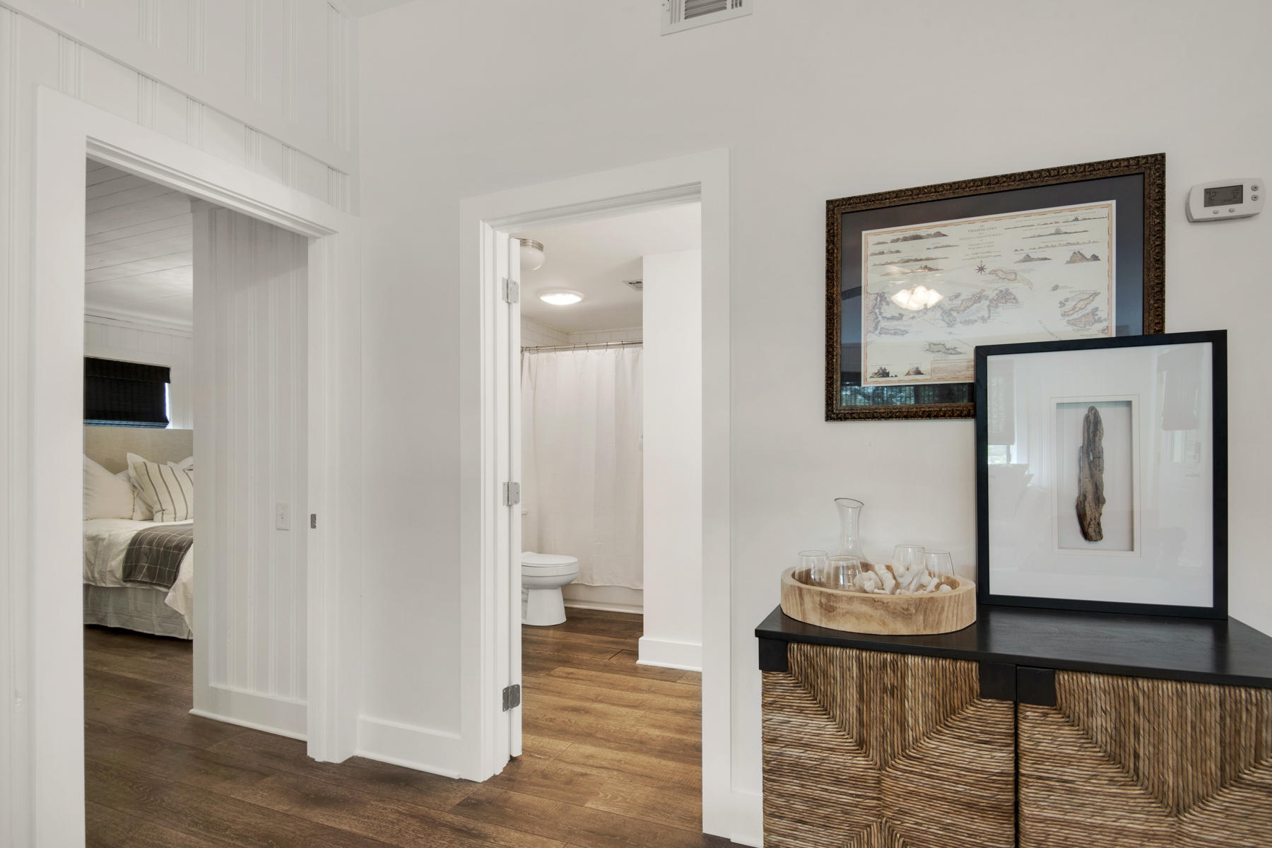537 Ricker Avenue Santa Rosa Beach, FL 32459 - Photo 6 of 18 a view of a hallway with wooden floor and furniture