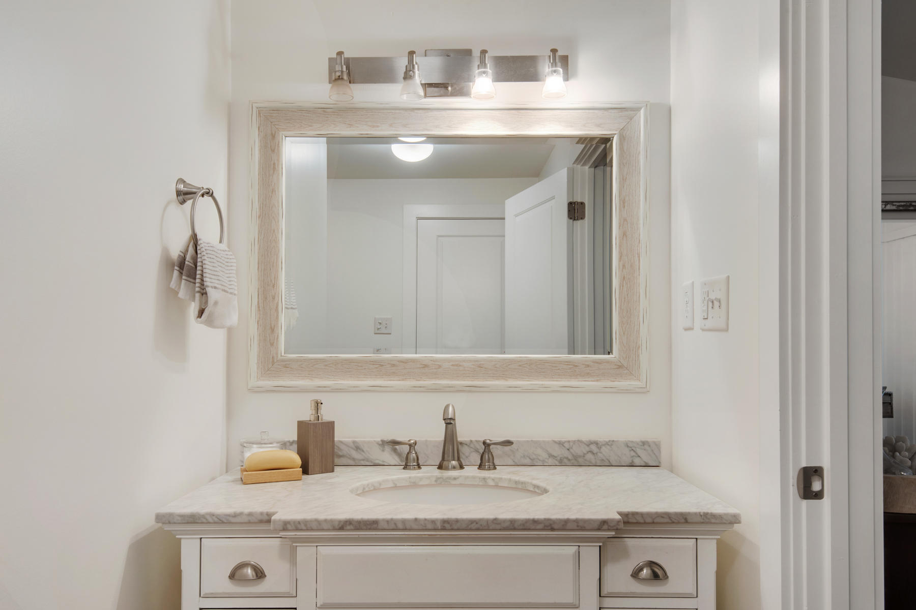 537 Ricker Avenue Santa Rosa Beach, FL 32459 - Photo 10 of 18 a bathroom with a sink and a mirror