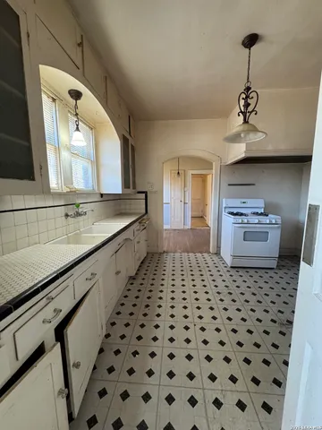 a bathroom with a sink a vanity and a mirror