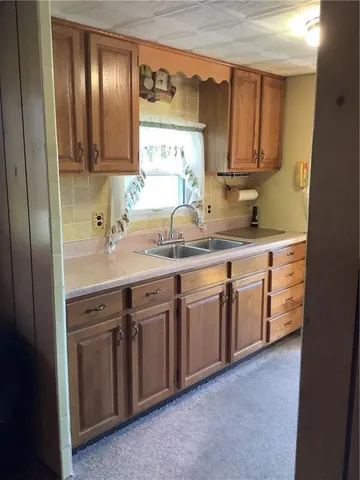 a kitchen with a stove and a refrigerator