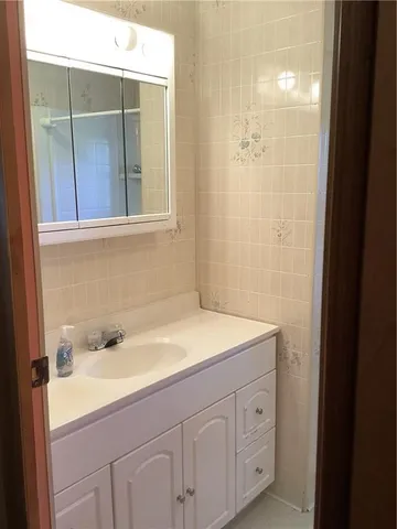 a bathroom with a sink and mirror