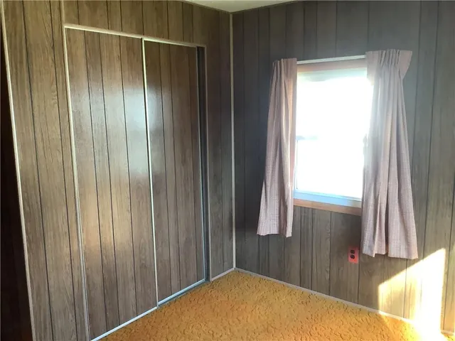 a bathroom with a shower and a sink