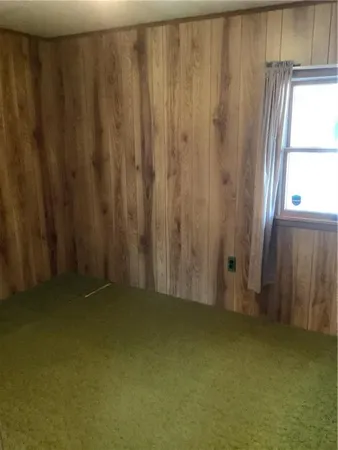 a bathroom with a shower and a window