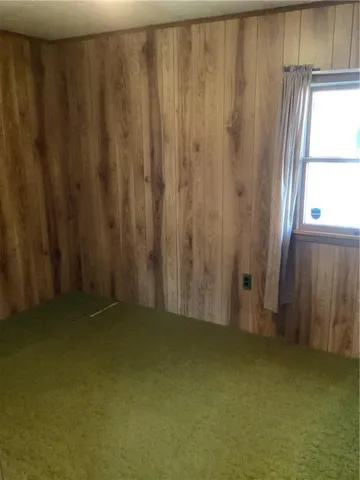 a bathroom with a shower and a window