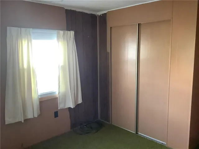 a view of a bathroom with a glass door and shower