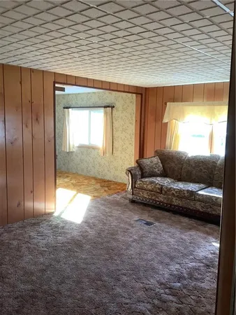a living room with a couch and a window