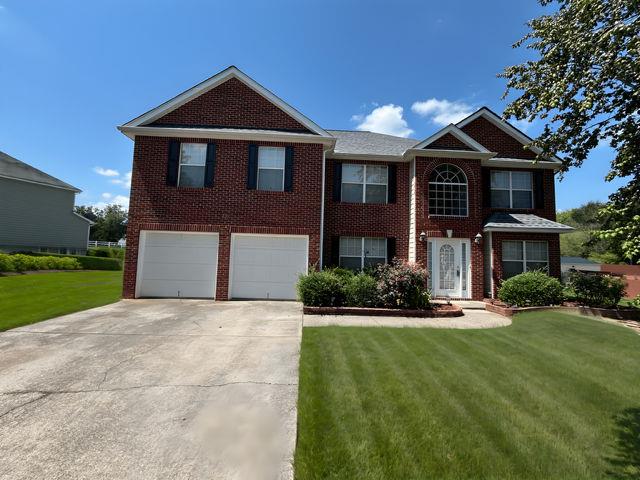 4350 Defoors Farm Trail Powder Springs, GA 30127 - Photo 1 of 47 a front view of a house with a yard