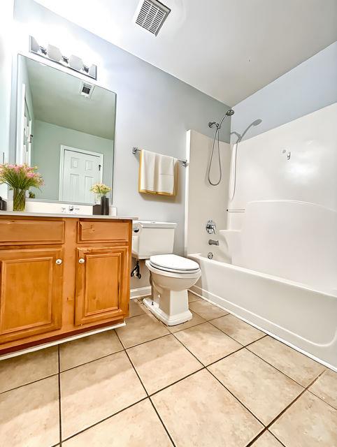 4350 Defoors Farm Trail Powder Springs, GA 30127 - Photo 15 of 47 a bathroom with a sink a toilet and shower