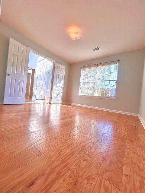 4350 Defoors Farm Trail Powder Springs, GA 30127 - Photo 16 of 47 an empty room with wooden floor and windows