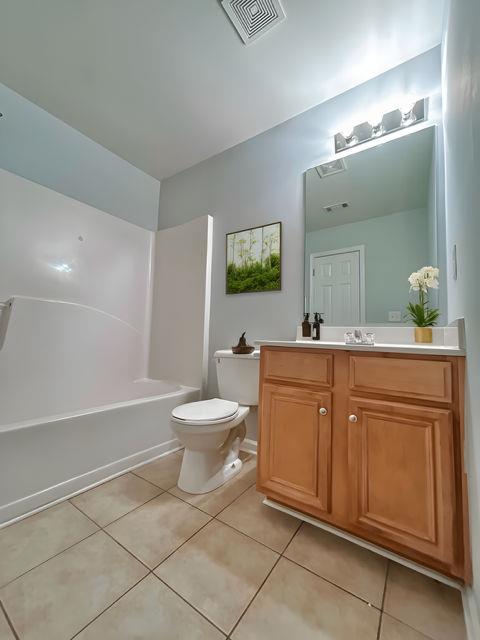 4350 Defoors Farm Trail Powder Springs, GA 30127 - Photo 22 of 47 a spacious bathroom with a toilet sink and mirror