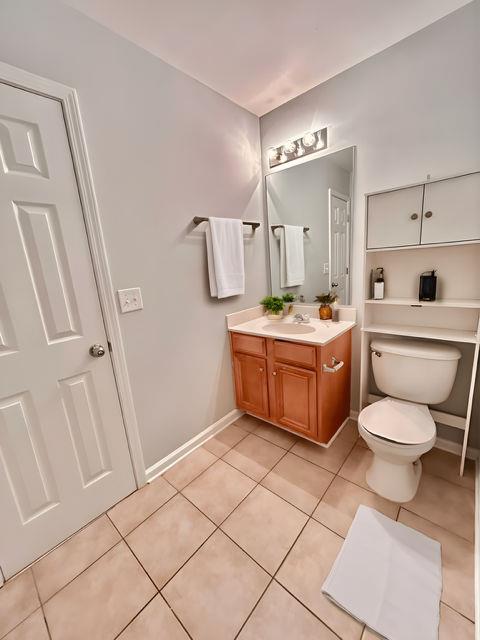 4350 Defoors Farm Trail Powder Springs, GA 30127 - Photo 25 of 47 a bathroom with a sink a toilet and mirror