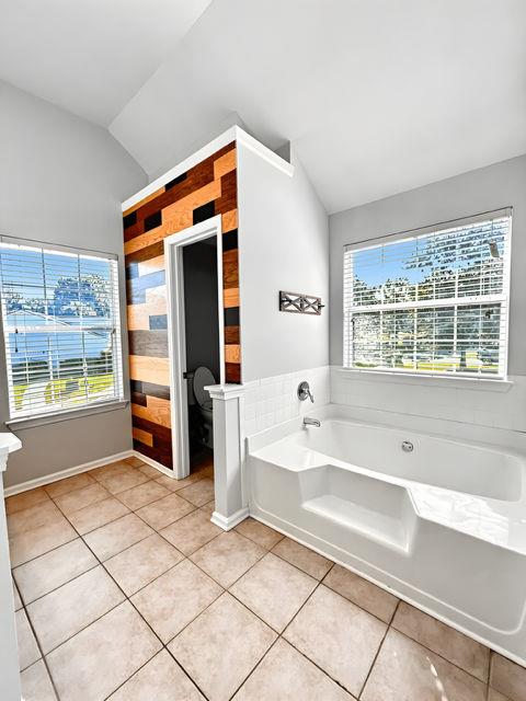 4350 Defoors Farm Trail Powder Springs, GA 30127 - Photo 38 of 47 a spacious en suite bathroom with a tub and window