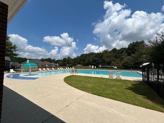 4350 Defoors Farm Trail Powder Springs, GA 30127 - Photo 43 of 47 a view of a swimming pool with lounge chair