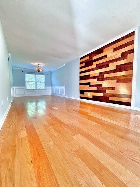 4350 Defoors Farm Trail Powder Springs, GA 30127 - Photo 6 of 47 a view of empty room with kitchen natural light and wooden floor