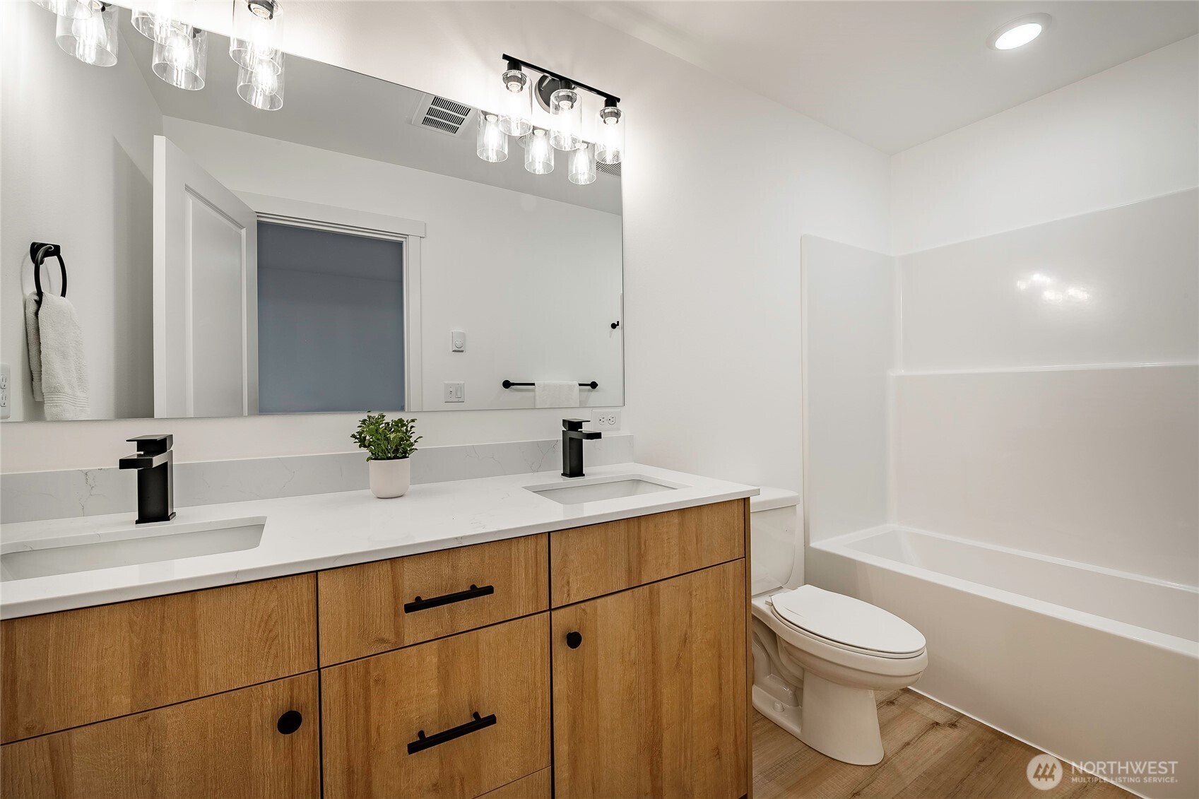 2999 Cedar View Road Blaine, WA 98230 - Photo 25 of 37 a bathroom with a sink a toilet a mirror and shower