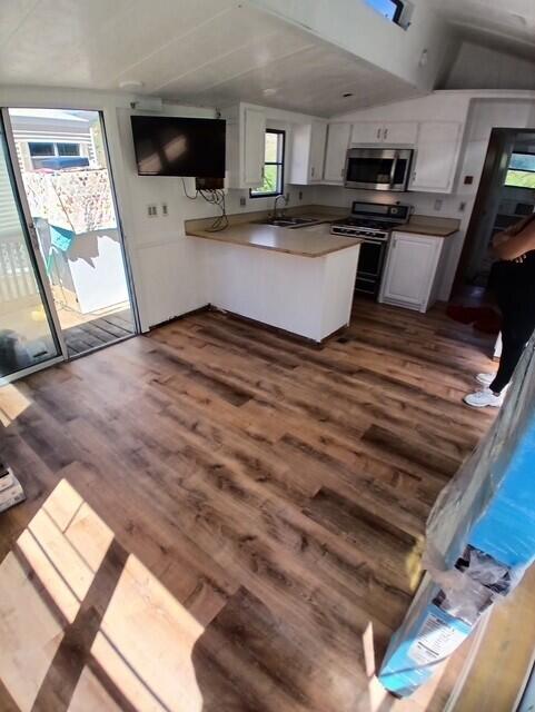 3750 Paradise Road, Unit 100 Santa Barbara, CA 93105 - Photo 6 of 14 a view of kitchen and living room with wooden floor