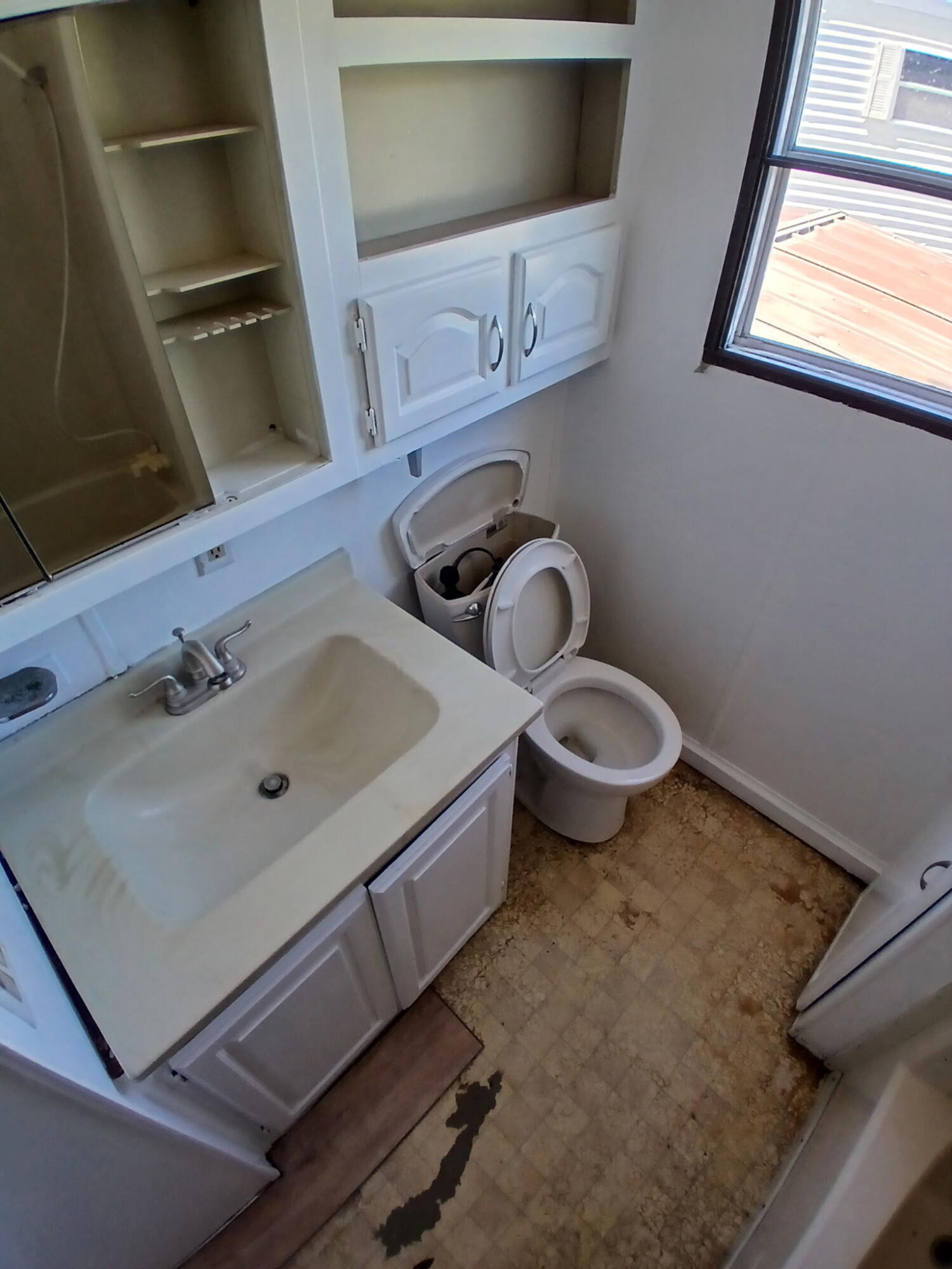 3750 Paradise Road, Unit 100 Santa Barbara, CA 93105 - Photo 7 of 14 a bathroom with a sink toilet and mirror
