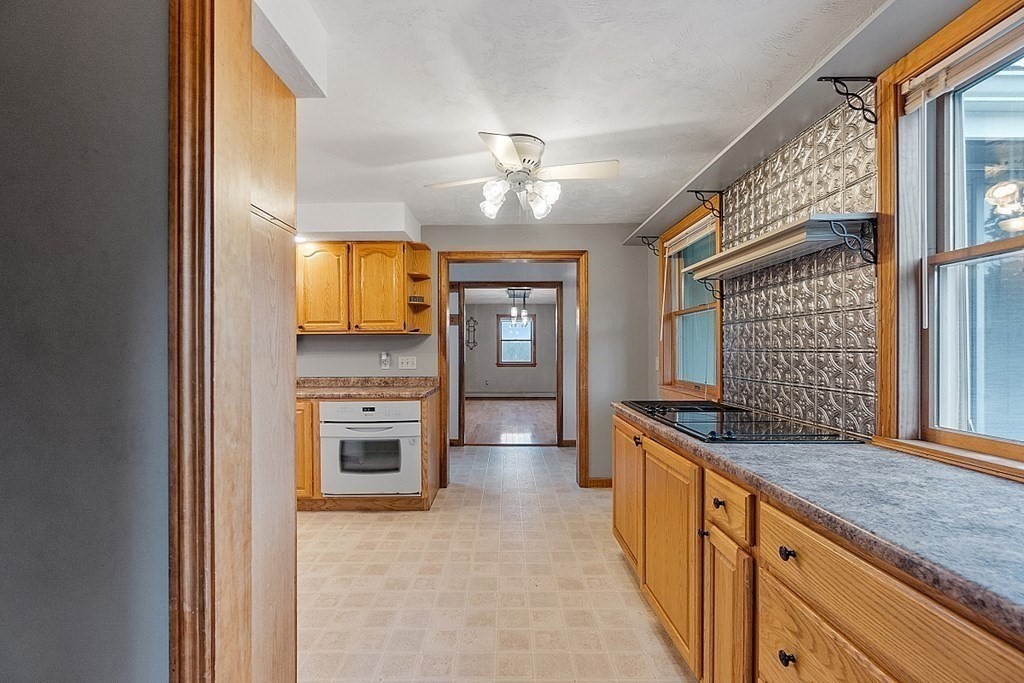 88 North End Road Townsend, MA 01469 - Photo 16 of 42 a kitchen with granite countertop a stove oven and a sink