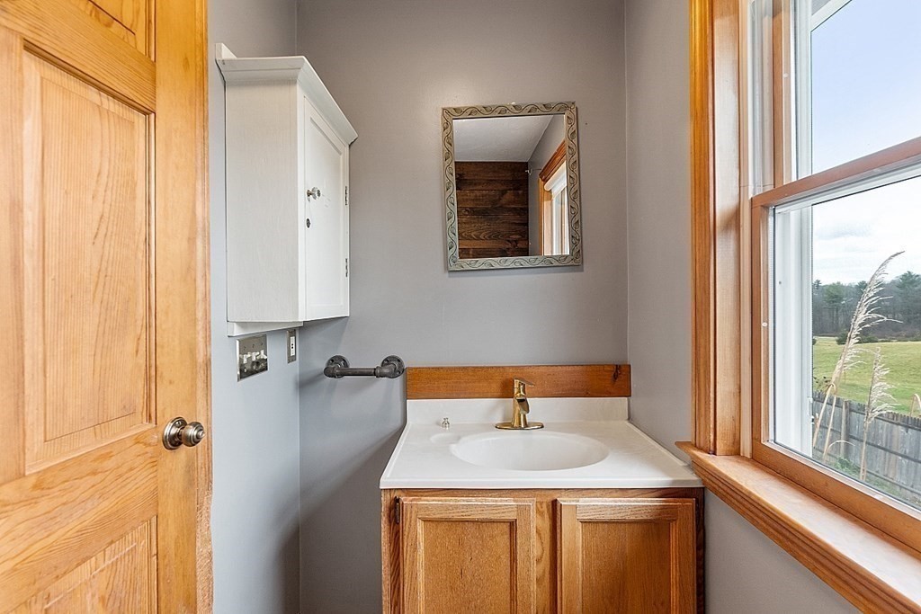 88 North End Road Townsend, MA 01469 - Photo 20 of 42 a bathroom with a sink and a mirror