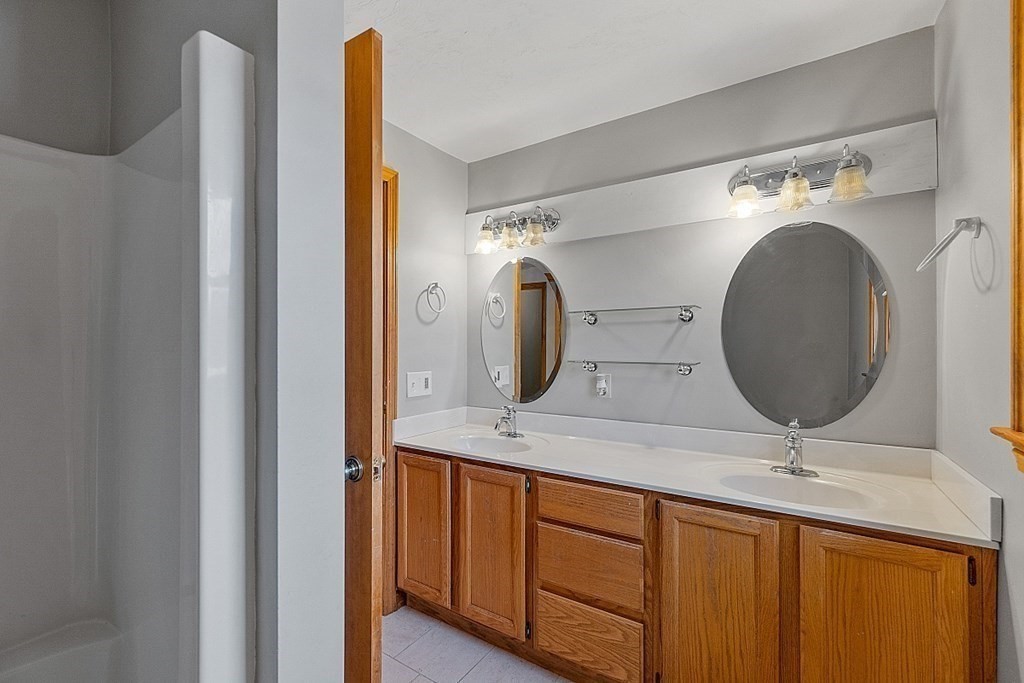 88 North End Road Townsend, MA 01469 - Photo 23 of 42 a bathroom with a double vanity sink and a mirror