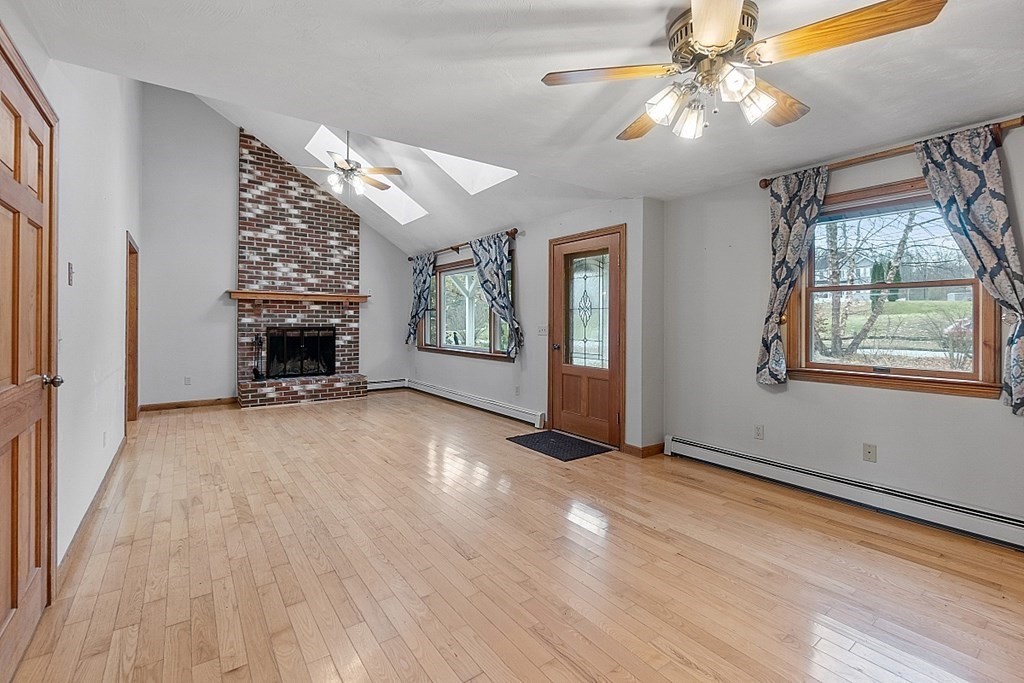 88 North End Road Townsend, MA 01469 - Photo 7 of 42 wooden floor in an empty room with a window
