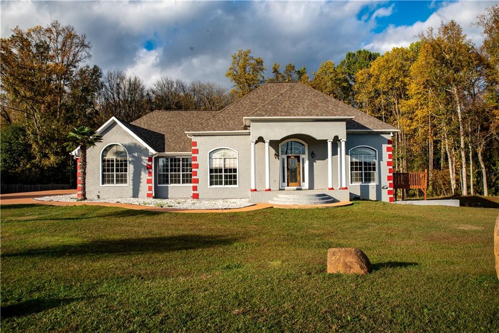 147 Babbs Mill Road Hampton, GA 30228 - Photo 1 of 1 front view of a house with swimming pool and a yard