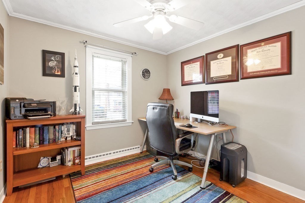 51 Forest Street Reading, MA 01867 - Photo 13 of 22 a view of a workspace with furniture and a window