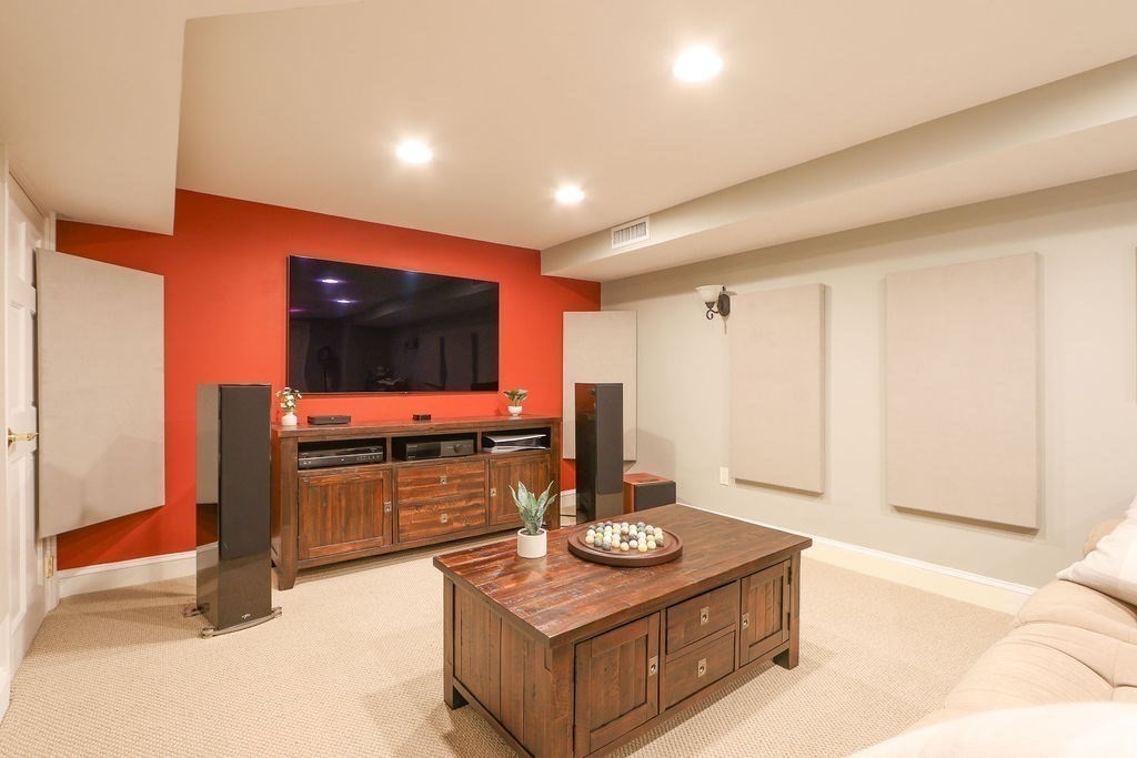 51 Forest Street Reading, MA 01867 - Photo 15 of 22 a living room with furniture and a flat screen tv