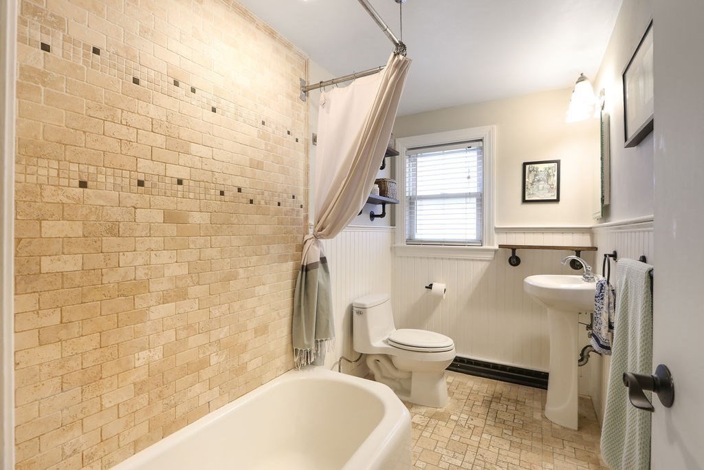 51 Forest Street Reading, MA 01867 - Photo 16 of 22 a bathroom with a sink toilet and shower