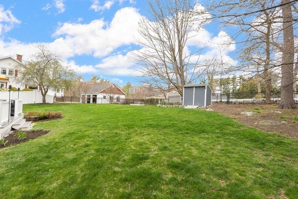 51 Forest Street Reading, MA 01867 - Photo 18 of 22 a view of a park with large trees