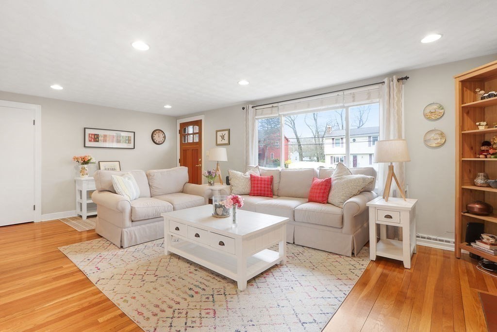 51 Forest Street Reading, MA 01867 - Photo 2 of 22 a living room with furniture and a large window
