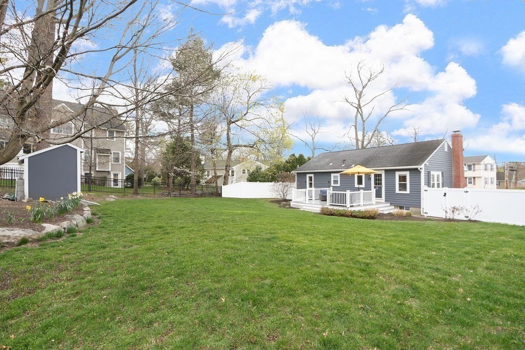 51 Forest Street Reading, MA 01867 - Photo 21 of 22 a front view of a house with garden