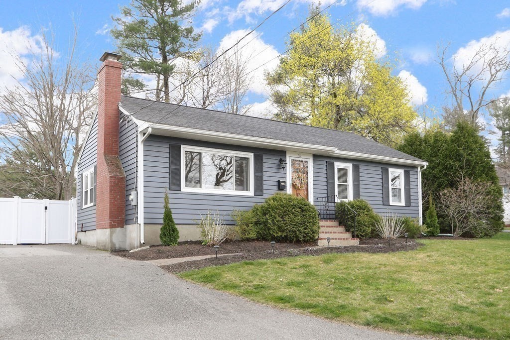 51 Forest Street Reading, MA 01867 - Photo 22 of 22 a front view of a house with garden